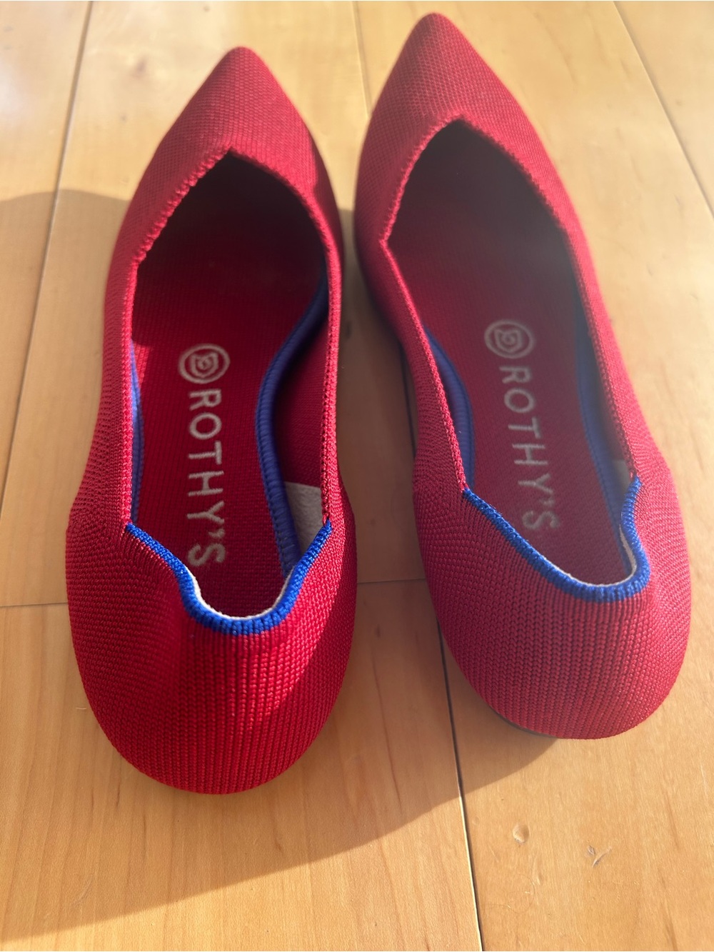Rothy's Red Pointed Knit Flats with Blue Trim. Machine washable. Like new.